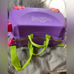 Gently used Melissa & Doug purprle Trunki